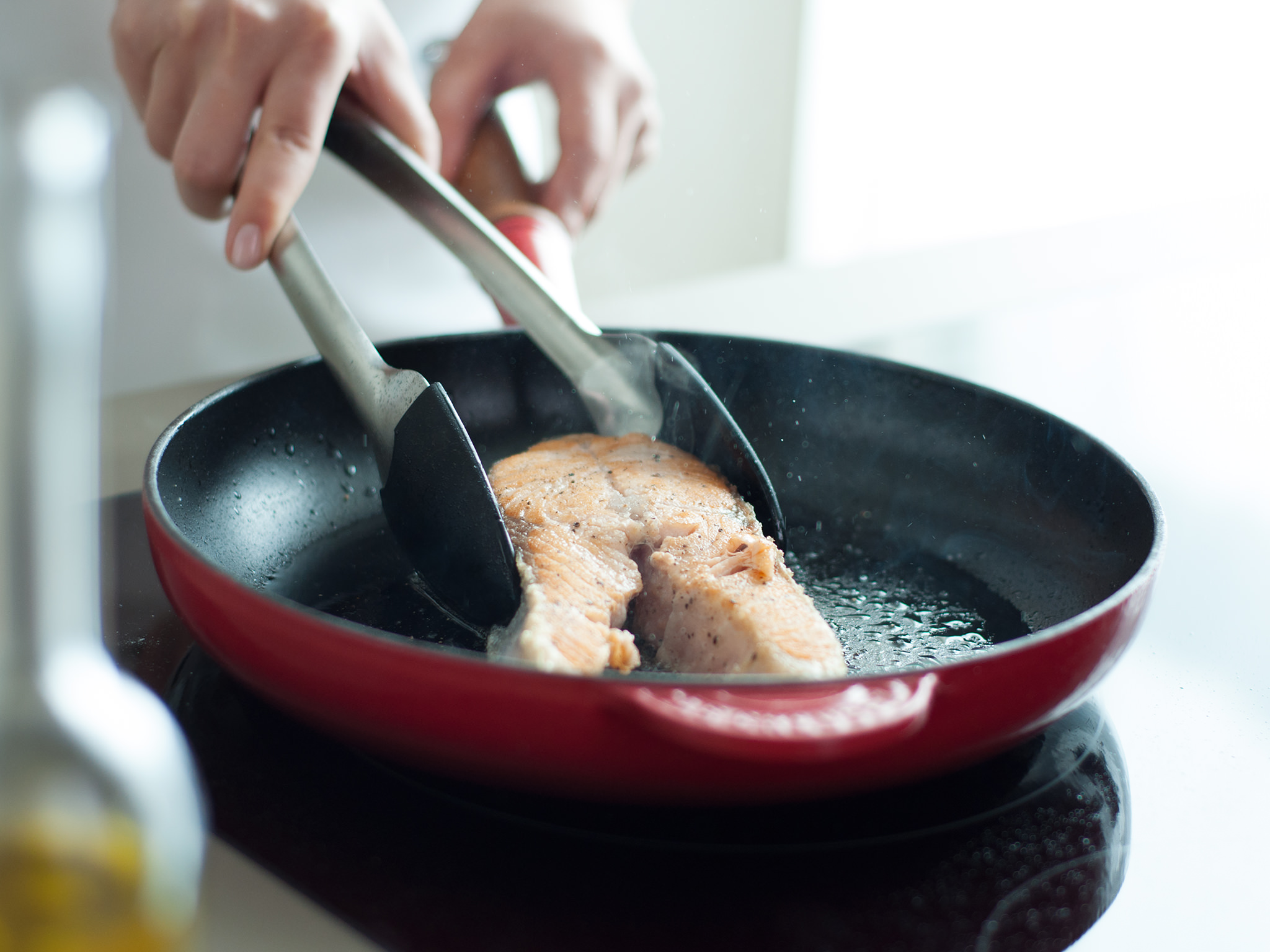 Fried salmon on baby leaf salad