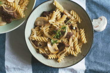 Pasta with strips of beef and creamy mushrooms