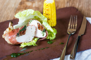 Stuffed serrano-wrapped chicken