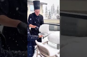 Chef’s knife carves snow on round table—flakes fall, Ciruas morning drapes silence over white feast.
