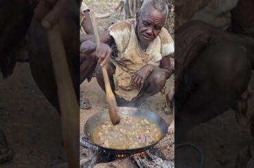 Hadzabe Cooking and Sharing Fresh Hot Portions #Hadzabe #HotPortions #TribalLife #WildFood #shorts