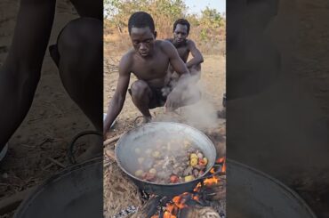 Hadzabe Cooking and Sharing a Warm Camp Meal #Hadzabe #CampMeal #TribalLife #WildFood #shorts
