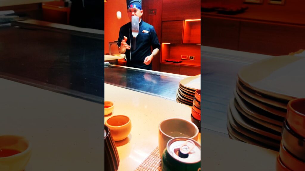 Hibachi Chef singing and grilling for everyone at the table. Even having an Egg gender reveal.