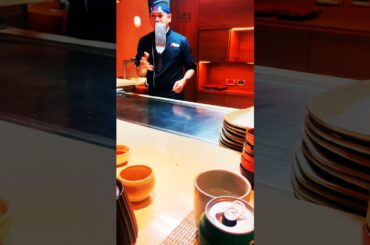 Hibachi Chef singing and grilling for everyone at the table. Even having an Egg gender reveal.