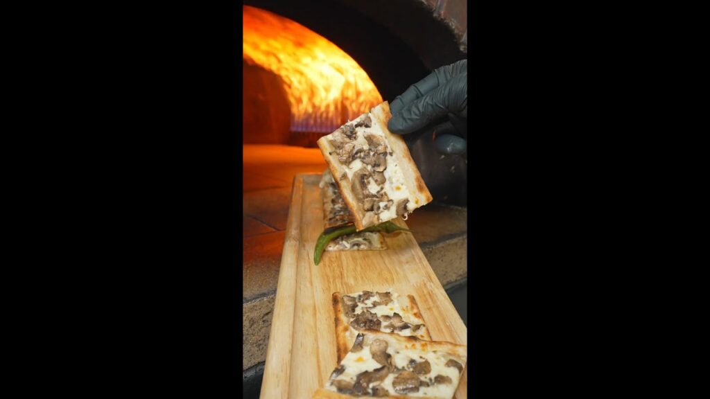 Fresh out of the stone oven, finished with the chef’s final touch