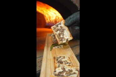 Fresh out of the stone oven, finished with the chef’s final touch