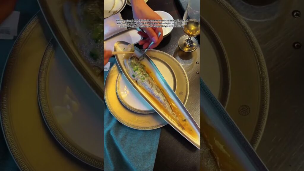 Debone steamed whole fish expertly at the table using fine service chopsticks