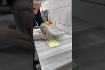 Chef Builds Cake On Table