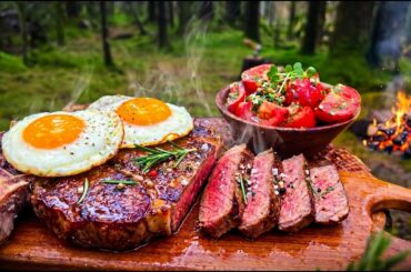 Garlic Butter Steak Cooked Over a Campfire in Rainy Alaska Forest