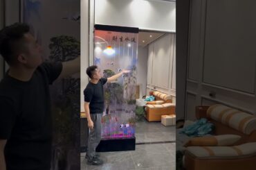 The living and dining areas are connected by a transparent water