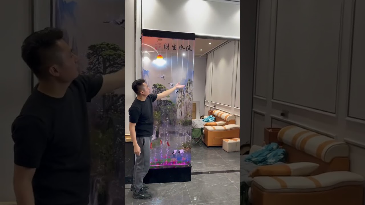 The living and dining areas are connected by a transparent water The living and dining areas are connected by a transparent water