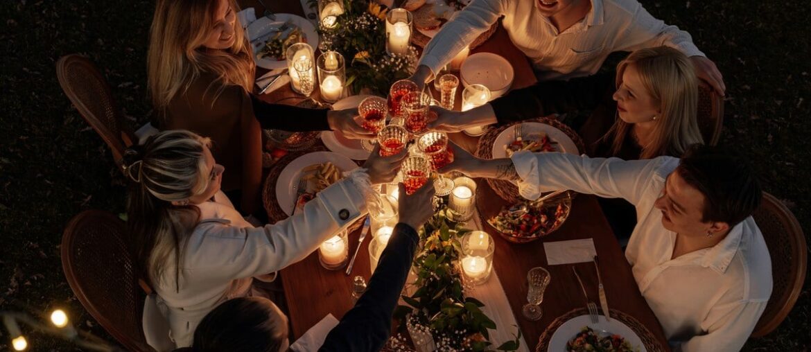 Diners gather around a communal outdoor table to enjoy dishes inspired by West Virginia's Appalachian food traditions, reflecting the state's growing reputation as a destination for authentic local cuisine. (Photo courtesy Ahmet Kurt)