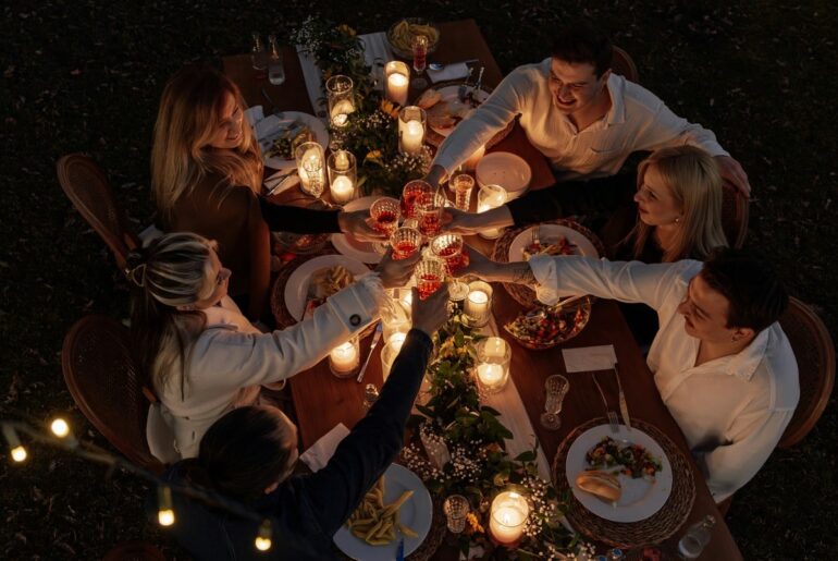 Diners gather around a communal outdoor table to enjoy dishes inspired by West Virginia's Appalachian food traditions, reflecting the state's growing reputation as a destination for authentic local cuisine. (Photo courtesy Ahmet Kurt)