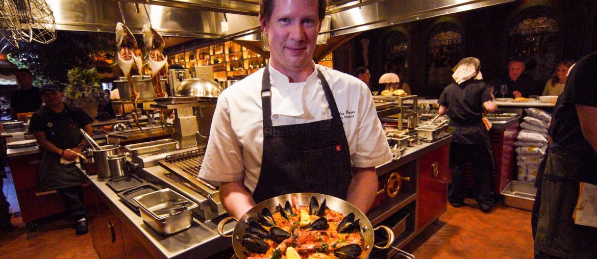 Chef Nicholas Dixon with a paella dish at Dalia.