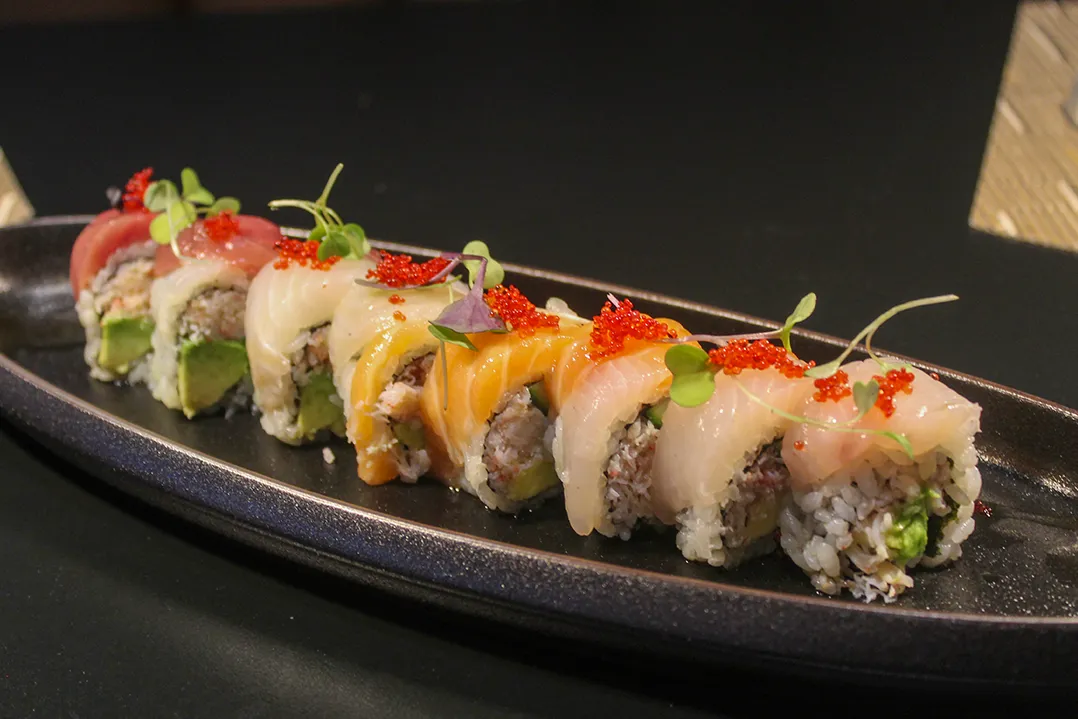 Fish is flown in twice a week from Japan. Rainbow sushi, made with tuna and salmon, topped with fish eggs is a featured dish. (Photo by Spencer Durham)