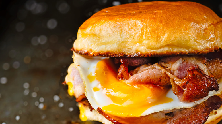 Close up of a bacon and egg sandwich