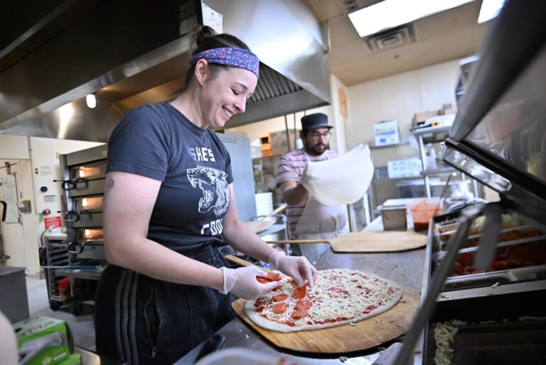 Anne Thompson (left) and Daniel Rodriguez, owners of Joanie's Pizza, a New York style take-out shop in Chelmsford.